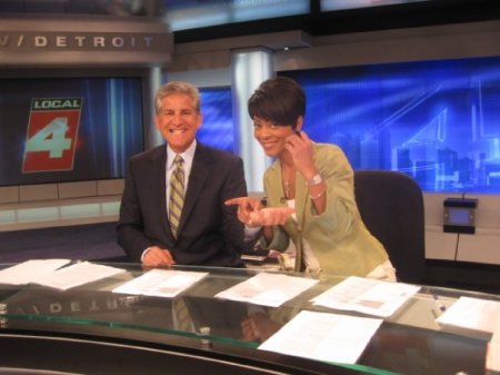 Rhonda helping Guy get a splinter out of his finger during a commercial break. Just another morning at Local 4.